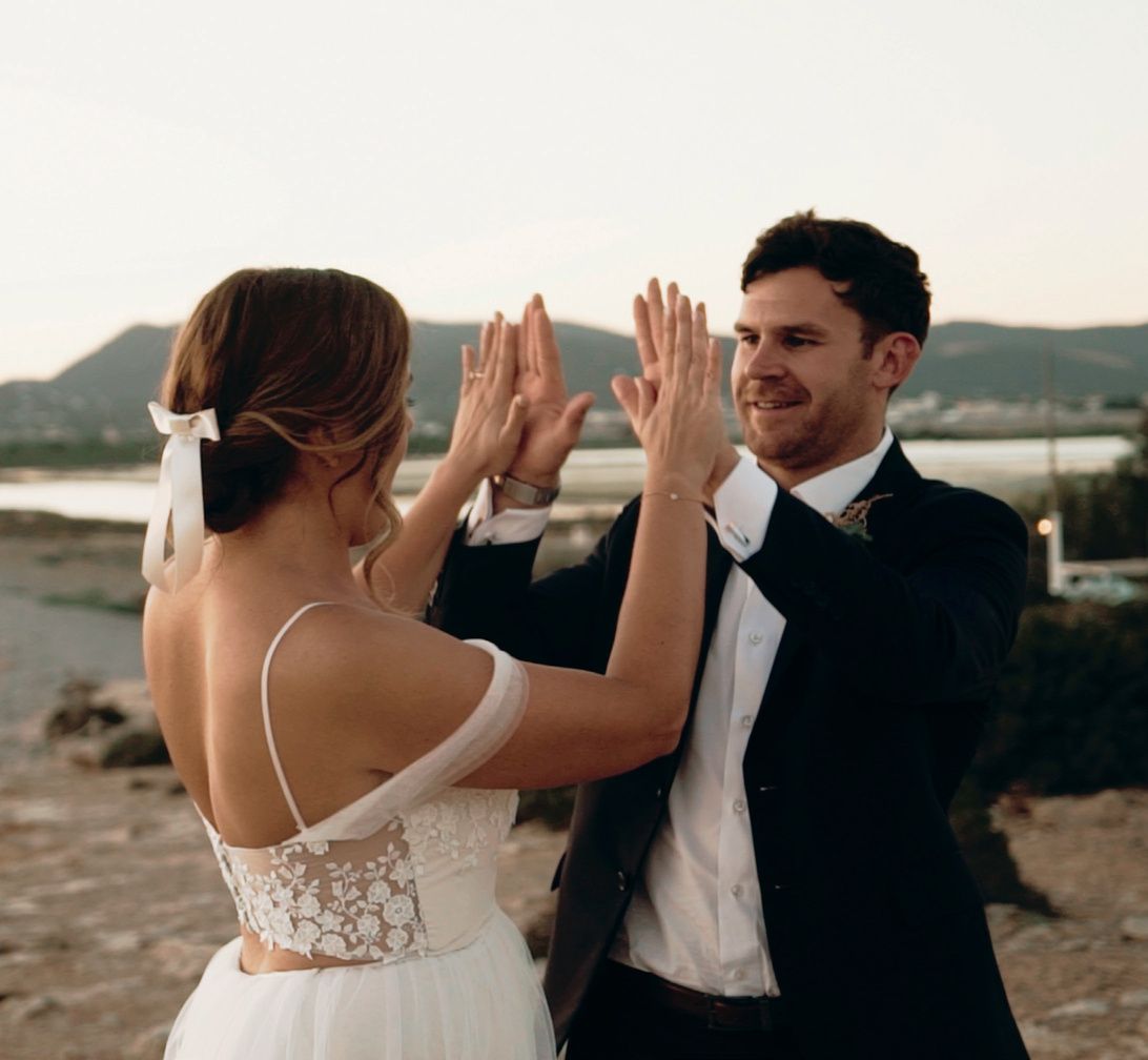 Vertical social clip of a couple giving a high five